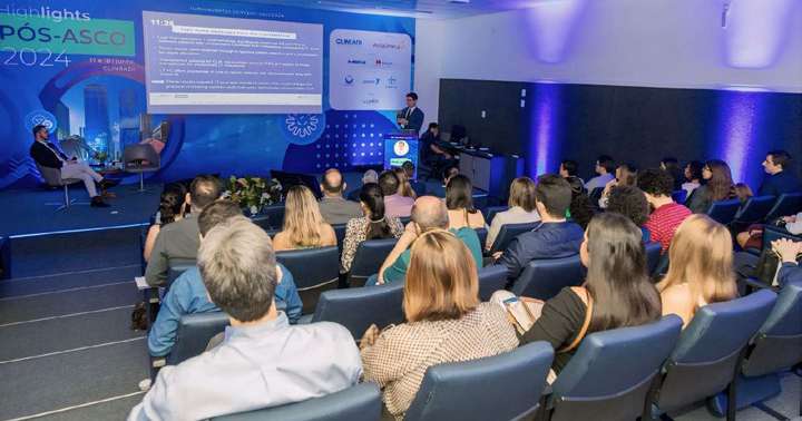 Plateia de médicos no auditório durante o Encontro Pós-ASCO 2024